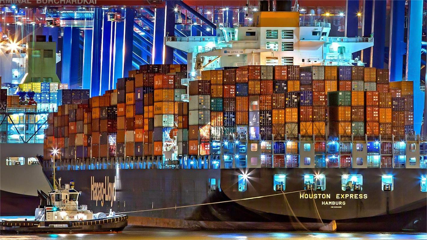 Oversized furniture being loaded into an open top container at a Chinese port