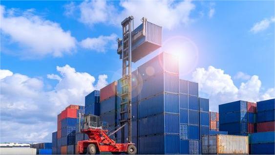 Refrigerated container being loaded with lighting equipment at a Chinese port